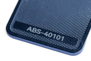 ABS 40101 - KIT3D GmbH – 3D-Technologie & Konstruktion Close-up of a dark textured device corner with the model number ABS-40101 visible.