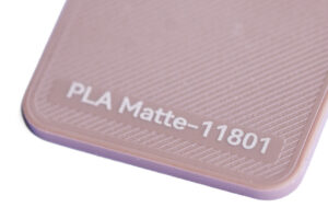 PLA Matte 11801 - KIT3D GmbH – 3D-Technologie & Konstruktion Close-up of pink PLA Matte-11801 filament label with a textured surface.